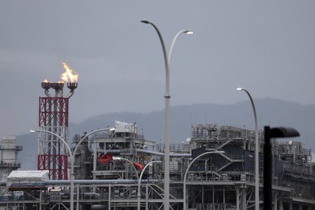 LNG Canada's flare stack burns above its LNG (liquid natural gas) export facility on Canada's Pacific coast in Kitimat, British Columbia, Canada August 18, 2025. REUTERS/Jesse Winter/File Photo