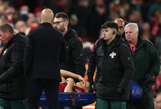 Soccer Football - Carabao Cup - Third Round - Liverpool v Southampton - Anfield, Liverpool, Britain - September 23, 2025 Liverpool's Giovanni Leoni reacts as he is stretchered off after sustaining an injury as manager Arne Slot looks on REUTERS/Phil Noble