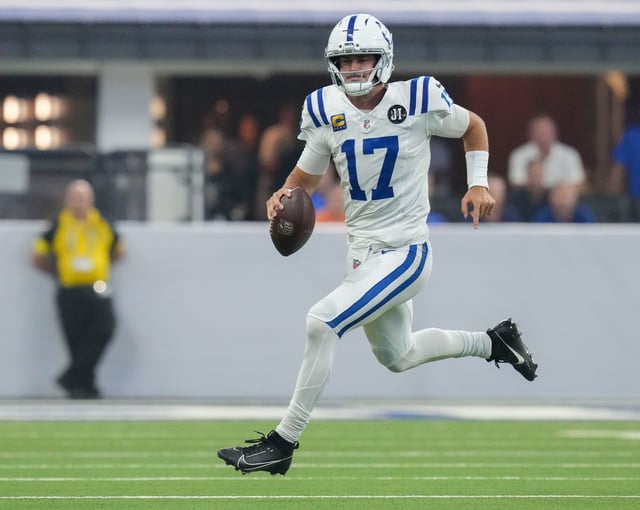 Indianapolis Colts quarterback Daniel Jones (17) rushes for a first down Sunday, Sept. 14, 2025, during a game against the Denver Broncos at Lucas Oil Stadium in Indianapolis.