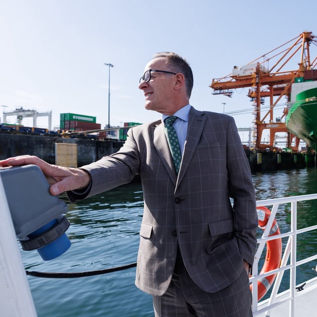 Peter Xotta, the president and CEO of the Vancouver Fraser Port Authority, surveys the docks at the GCT Vanterm shipping terminal during a tour of Vancouver’s Burrard Inlet on September 22, 2025