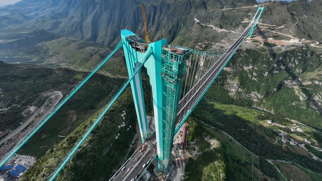 Huajiang Canyon Bridge is the latest dizzying project under construction, and will be the highest in the world