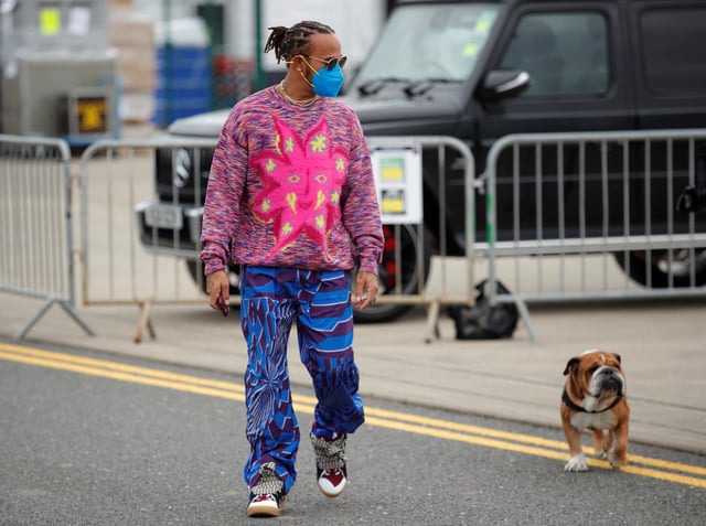 Formula One F1 - British Grand Prix - Silverstone Circuit, Silverstone, Britain - July 15, 2021 Mercedes' Lewis Hamilton arrives with his dog Roscoe ahead of the British Grand Prix REUTERS/Andrew Couldridge/File Photo