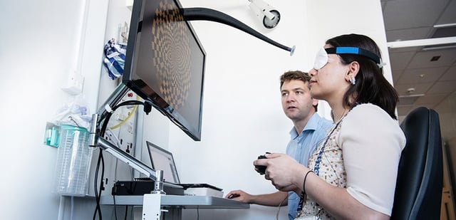 Dr Nick Cunniffe running a “visual evoked potential” test with a trial participant in the Cambridge Clinical Vision Laboratory.