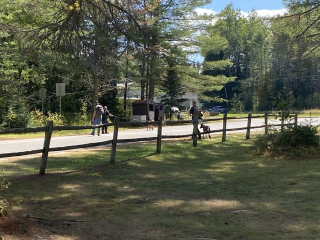 State troopers with police dogs prepare to search an area near where a truck that belongs to Anthony Bechand, 53, was found Sunday in the Adirondack Mountain town of Brighton. 