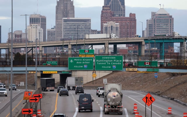 Commercial trucks can be seen in the lane towards the Ambassador Bridge to Windsor, Ontario, in Detroit, Michigan, U.S., February 1, 2025.    REUTERS/Rebecca Cook/File Photo