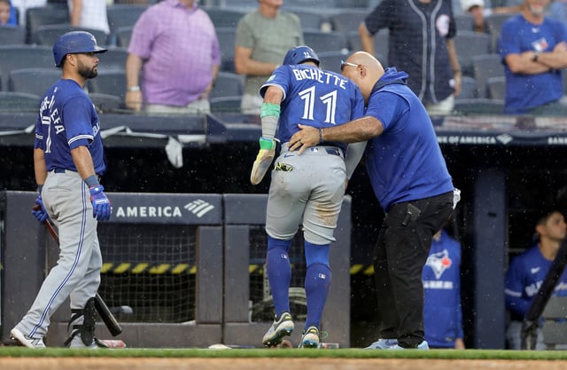 NEW YORK, NEW YORK - SEPTEMBER 06:  Bo Bichette #11 of the Toronto Blue Jays is helped off the field after he was tagged out at the plate ending the sixth inning against the New York Yankees at Yankee Stadium on September 06, 2025 in New York City. (Photo by Jim McIsaac/Getty Images)
