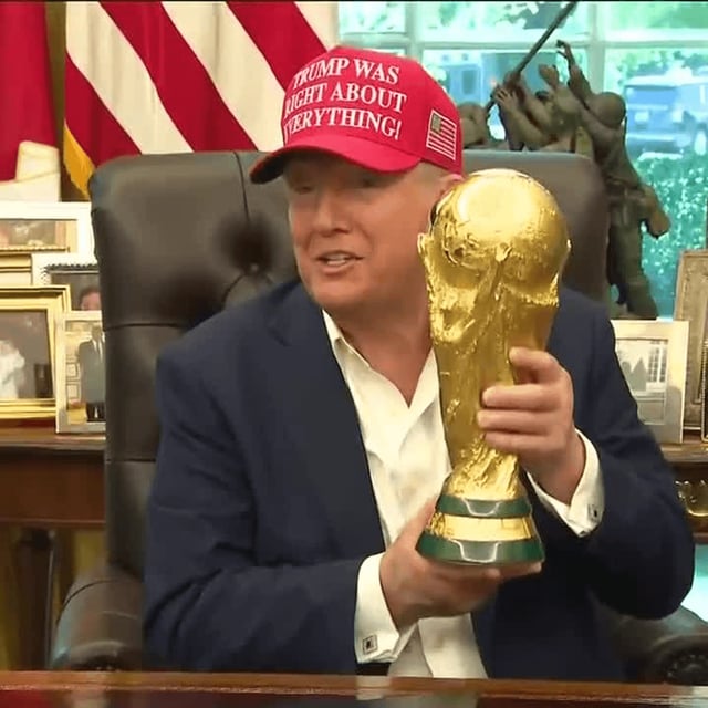 President Donald Trump seen holding the FIFA World Cup Trophy, as Giovanni Vincenzo Infantino, the head of the international organization, visited the White House.