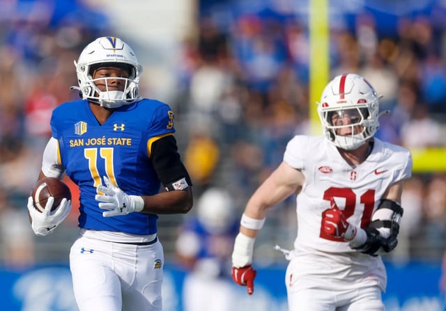 San Jose State wide receiver Justin Lockhart (11) runs with the ball against Stanford’s Scotty Edwards (21) in the first quarter at CEFCU Stadium in San Jose, Calif., on Friday, Nov. 29, 2024. (Shae Hammond/Bay Area News Group)