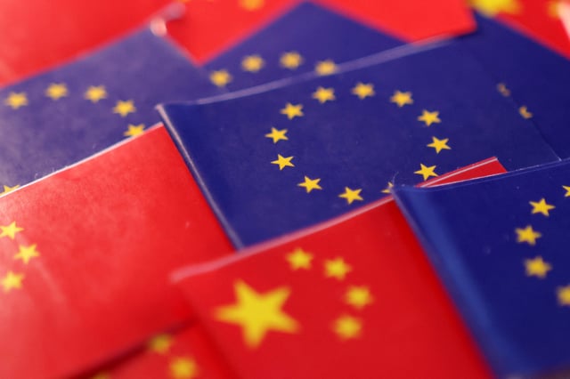 EU and Chinese flags are seen in this illustration taken, March 20, 2025. REUTERS/Dado Ruvic/Illustration/File Photo