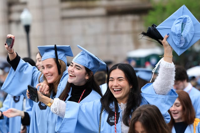 Students celebrate during the Commencement Ceremony at Columbia University in New York on May 21, 2025. (Photo by CHARLY TRIBALLEAU / POOL / AFP)