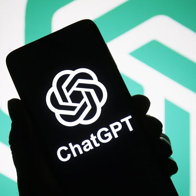 ChatGPT logo of a chatbot launched by OpenAI is seen on a smartphone in a hand.