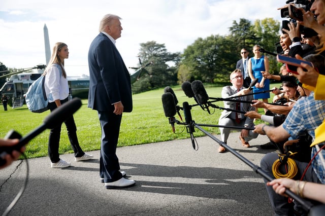 President Donald Trump speaks to members of the media as he departs the White House  September 26, 2025 in Washington, DC.