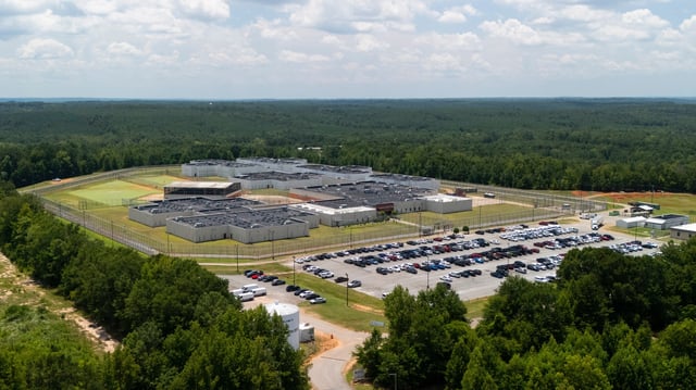The Stewart Detention Center, a private prison operated by CoreCivic under contract with the U.S. Immigration and Customs Enforcement is seen Tuesday, July 29, 2025, near Lumpkin, Ga. (AP Photo/Mike Stewart)