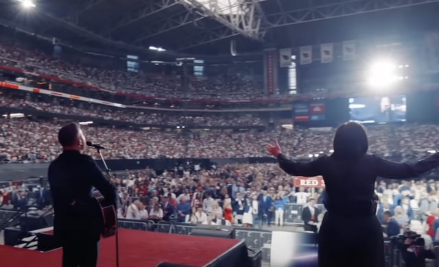 Singers leading worship songs at the beginning of the Charlie Kirk memorial service. (Screencap)