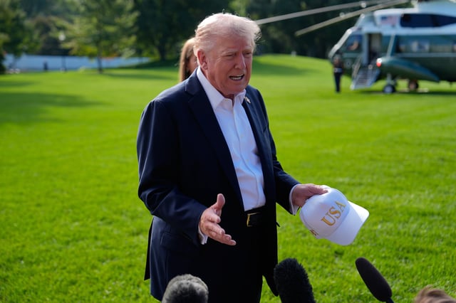 President Donald Trump speaks with reporters before departing the White House, Friday, Sept. 26, 2025, in Washington. (AP Photo/Julia Demaree Nikhinson)