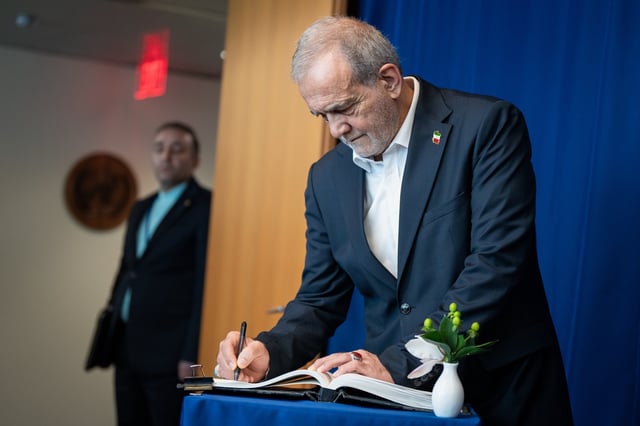 Masoud Pezeshkian, the President of Iran, signs a note in a United Nations book during the U.N. General Assembly at United Nations headquarters, Thursday, Sept. 25, 2025. (AP Photo/Angelina Katsanis)