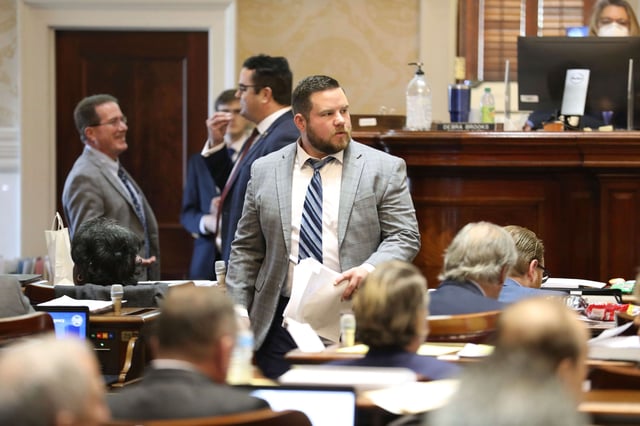 FILE - South Carolina Rep. RJ May, R-West Columbia, walks down the aisle of the House on Tuesday, March 14, 2023, in Columbia, South Carolina. (AP Photo/Jeffrey Collins, file)