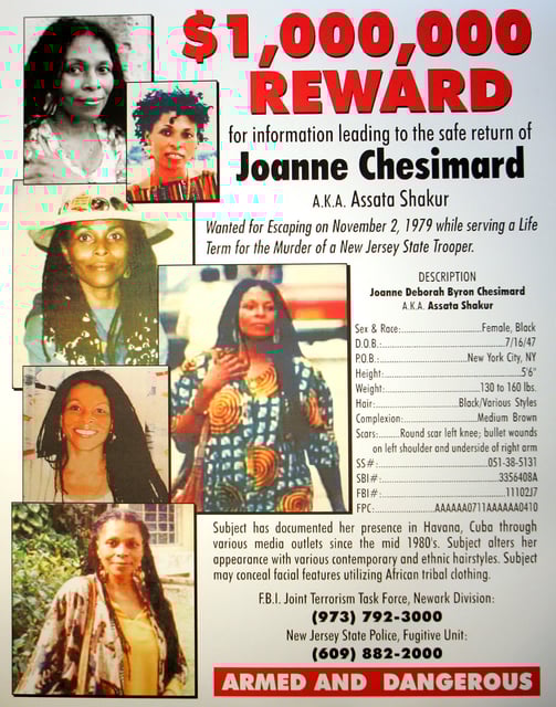 FILE - Photo of reward poster announcing the federal bounty for the capture of convicted killer Joanne Chesimard is now $1 Million in West Trenton, N.J. on Monday, May 2, 2005. (AP Photo/Tim Larsen, file)