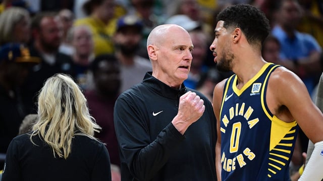 Oct 30, 2024; Indianapolis, Indiana, USA; Indiana Pacers Head Coach Rick Carlisle shares a moment with Indiana Pacers guard Tyrese Haliburton (0) during overtime at Gainbridge Fieldhouse. Mandatory Credit: Marc Lebryk-Imagn Images