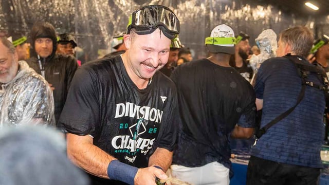 Sep 24, 2025; Seattle, Washington, USA; Seattle Mariners catcher Cal Raleigh (29), left, celebrates in the clubhouse after winning the American League West Division during a game against the Colorado Rockies at T-Mobile Park. Mandatory Credit: Stephen Brashear-Imagn Images