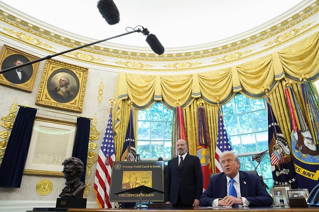 President Donald Trump speaks from the Oval Office after issuing an executive order raising the application fee for H-1B visas to $100,000, Sept. 19, 2025. With Mr. Trump is Commerce Secretary Howard Lutnick. 
