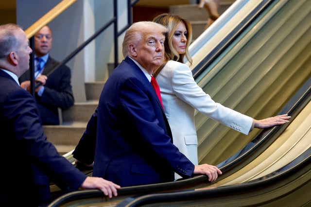 U.S. President Donald Trump and first lady Melania Trump ride an escalator as they arrive to attend the 80th United Nations General Assembly, in New York City, New York, U.S., September 23, 2025. REUTERS/Kylie Cooper/File Photo