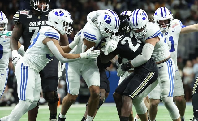 Colorado Buffaloes running back Isaiah Augustave (23) is gang tackled  by BYU defenders during the Valero Alamo Bowl in San Antonio on Saturday, Dec. 28, 2024. The two teams will meet again Saturday in Boulder in the Cougars' Big 12 opener.