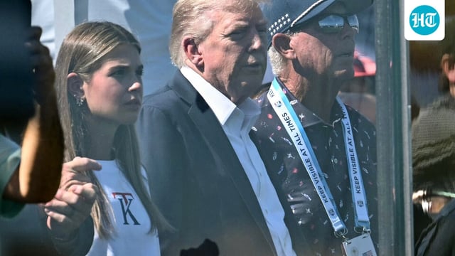 US President Donald Trump and his granddaughter Kai Trump attend the Ryder Cup golf tournament at Bethpage Black Golf Course in Farmingdale.