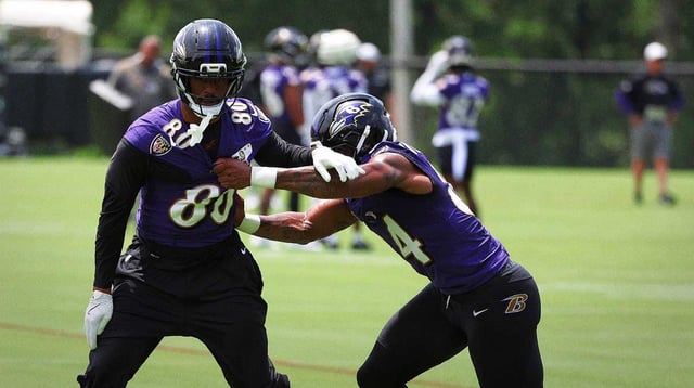 Jun 10, 2025; Baltimore, MD, USA; Baltimore Ravens tight end Isaiah Likely (80) runs past Baltimore Ravens tight end Zaire Mitchell-Paden (84) during an NFL OTA at Under Armour Performance Center. Mandatory Credit: Daniel Kucin Jr.-Imagn Images