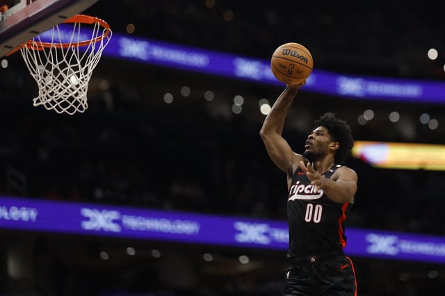 Feb 26, 2025; Washington, District of Columbia, USA; Portland Trail Blazers guard Scoot Henderson (00) dunks the ball against the Washington Wizards in the first half at Capital One Arena. Mandatory Credit: Geoff Burke-Imagn Images/File Photo