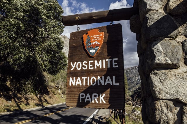 A Yosemite National Park sign is seen in El Portal. More than three dozen former park superintendents are urging President Trump to close Yosemite and all 433 national park sites if the government shuts down next week.