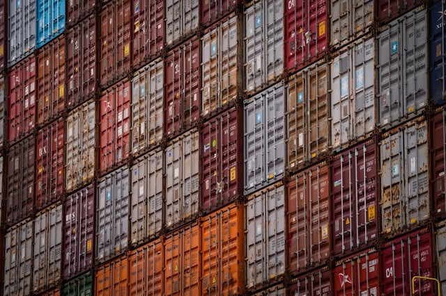Cargo containers are seen stacked on the Hapag-Lloyd container ship Frankfurt Express while docked at the DP World Centerm container terminal, in Vancouver, on Sunday, Aug. 3, 2025. THE CANADIAN PRESS/Darryl Dyck