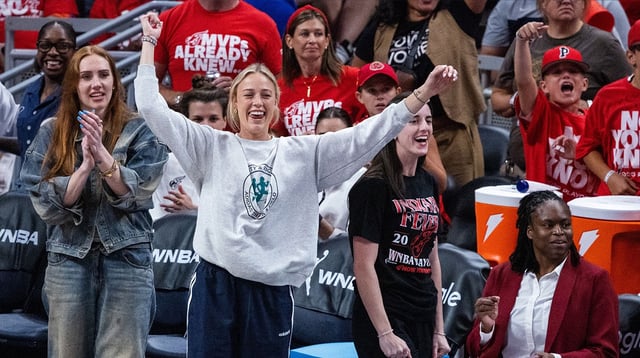 Sep 16, 2025; Indianapolis, Indiana, USA; Indiana Fever guard Caitlin Clark (22) and guard Sophie Cunningham (8) on the sideline during game two of round one against the Atlanta Dream for the 2025 WNBA Playoffs at Gainbridge Fieldhouse. Mandatory Credit: Trevor Ruszkowski-Imagn Images
