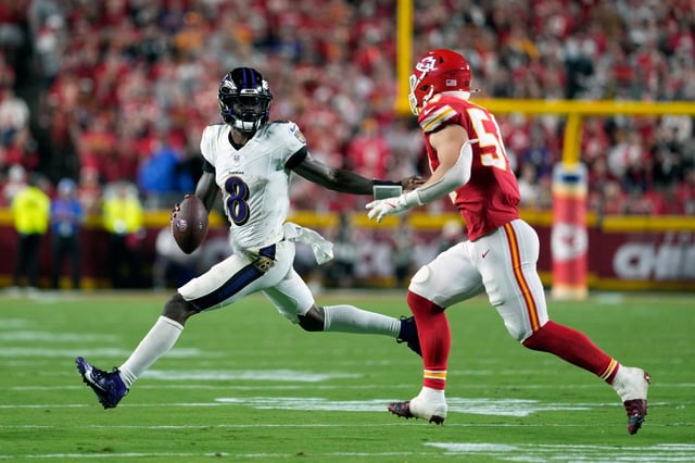 Baltimore Ravens quarterback Lamar Jackson (8) scrambles as Kansas City Chiefs linebacker Leo Chenal defends during the second half of an NFL football game Thursday, Sept. 5, 2024, in Kansas City, Mo. (AP Photo/Ed Zurga)