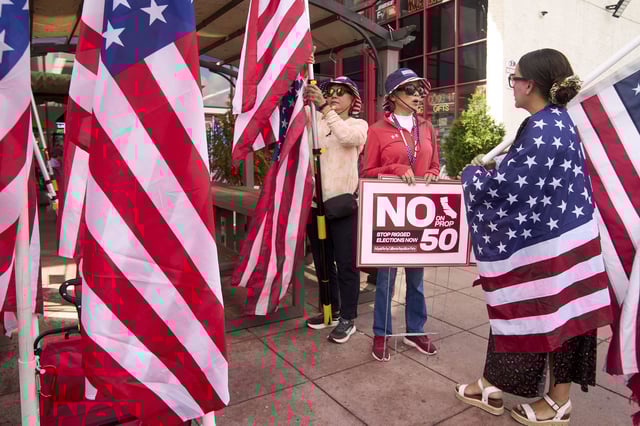 Opponents of California's Proposition 50 rally in Westminster on Sept. 10, 2025.