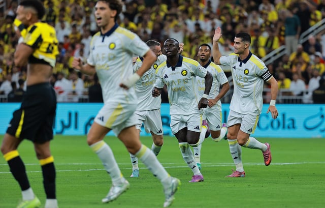 Soccer Football - Saudi Pro League - Al Ittihad v Al Nassr - King Abdullah Sport City Stadium, Jeddah, Saudi Arabia - September 26, 2025 Al Nassr's Sadio Mane celebrates scoring their first goal with Cristiano Ronaldo REUTERS/Stringer