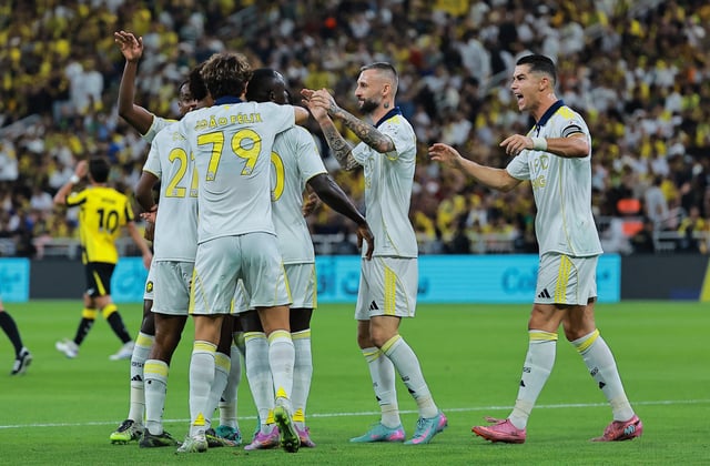 Soccer Football - Saudi Pro League - Al Ittihad v Al Nassr - King Abdullah Sport City Stadium, Jeddah, Saudi Arabia - September 26, 2025 Al Nassr's Sadio Mane celebrates scoring their first goal with Cristiano Ronaldo and Marcelo Brozovic REUTERS/Stringer