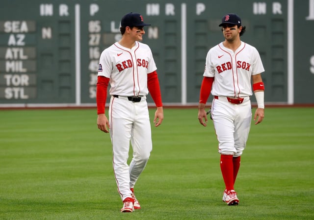 Boston Red Sox right fielder Roman Anthony, left, talks with teammate Marcelo Mayer during warmups before making his Major League debut in a game against the Tampa Bay Rays at Fenway Park on Monday. (AP Photo/Mary Schwalm)