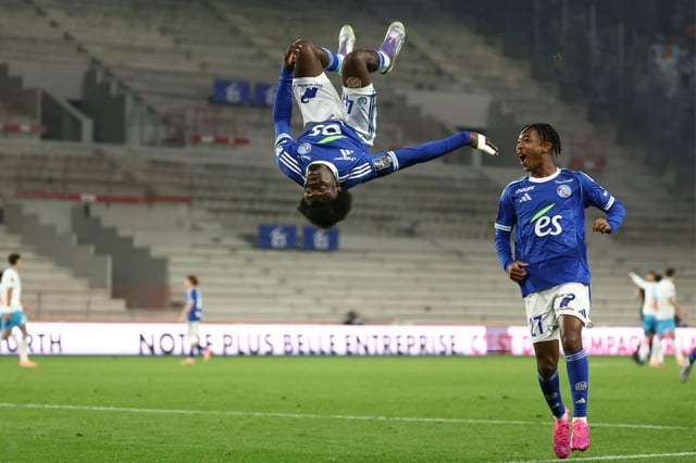 Strasbourg’s Ivorian midfielder Abdoul Ouattara (L) celebrates scoring the opening goal in a 2-1 defeat to Marseille