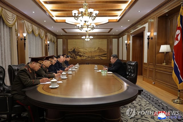 This photo, carried by North Korea's official Korean Central News Agency on Sept. 27, 2025, shows leader Kim Jong-un (R) presiding over a key consultative meeting on the production of nuclear materials and weapons the previous day. (For Use Only in the Republic of Korea. No Redistribution) (Yonhap)