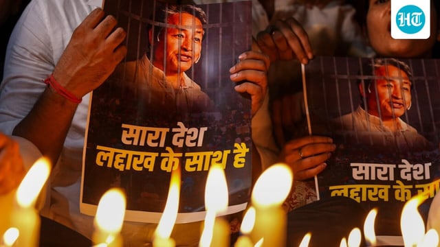 Agitators hold posters during a protest by AAP over the arrest of climate activist Sonam Wangchuk, at Jantar Mantar, in New Delhi, Friday, Sept. 26, 2025.