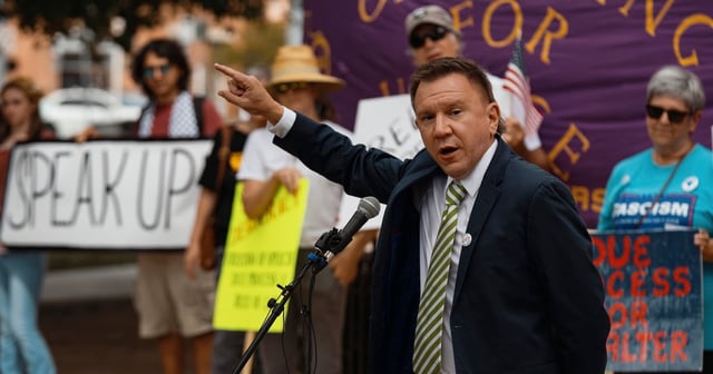 Thomas Alter delivers speaks at a rally calling for him to be reinstated in downtown San Marcos on Sept. 25, 2025. The Texas State University professor was fired by the university for remarks he made at a virtual conference put on by a socialist group.