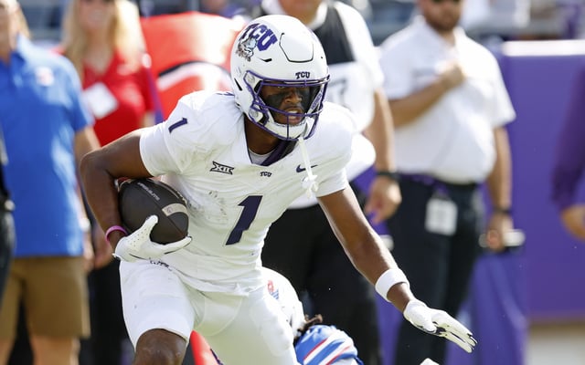 Eric McAlister #1 of the TCU Horned Frogs carries the ball against the SMU Mustangs before scoring a touchdown against the SMU Mustangs during the first half at Amon G. Carter Stadium on September 20, 2025 in Fort Worth, Texas.
