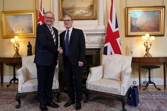 Britain's Prime Minister Keir Starmer shakes hands with Australian counterpart Anthony Albanese, inside 10 Downing Street in London, Britain, September 26, 2025. Alberto Pezzali/Pool via REUTERS