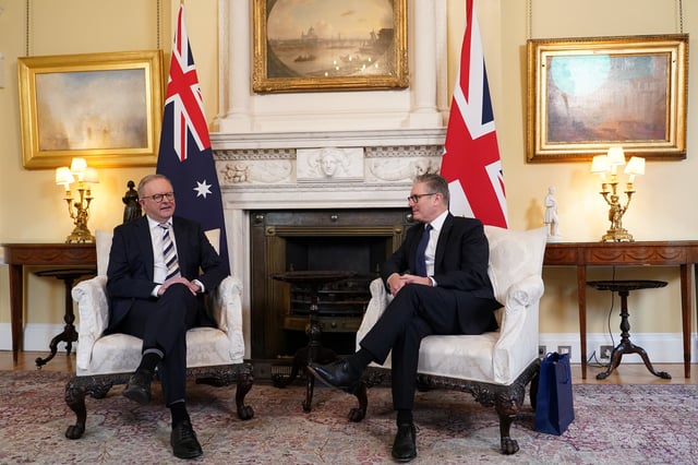 Britain's Prime Minister Keir Starmer listens to his Australian counterpart Anthony Albanese, inside 10 Downing Street in London, Britain, September 26, 2025. Alberto Pezzali/Pool via REUTERS