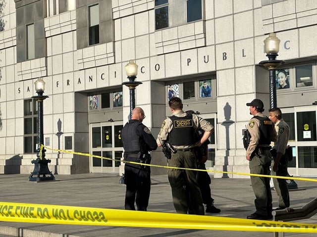 Police taped off the area outside the San Francisco Main Library where a person was shot on Friday.