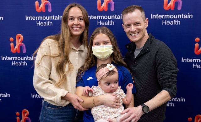 Annie Larrabee, left, Marissa Kauffman, center top, Elieanna Tibbs, center bottom, and her father, Justin, right, pose for a photo during a media event for Utah's first pediatric paired liver exchange at Intermountain Primary Children’s Hospital in Salt Lake City on Sept. 26, 2025.