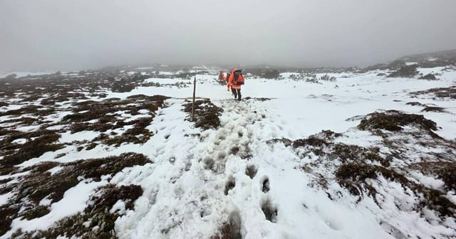 Rescue crews camped with the walkers at Cradle Mountain overnight. Picture supplied by police.