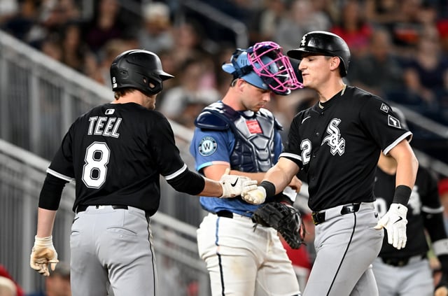 White Sox shortstop Colson Montgomery, right, slaps hands with Kyle Teel after hitting a two-run home run in the ninth inning against the Nationals on Sept. 26, 2025, in Washington. (Greg Fiume/Getty Images)