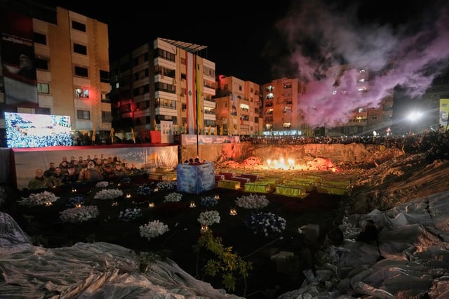 People gather at the site where Hezbollah leader Hassan Nasrallah was killed in Israeli airstrikes on Sept. 27, 2024, a day before the first anniversary of his death, in the Haret Hreik suburb south of Beirut, Lebanon, Friday, April 26, 2025. (AP Photo/Hassan Ammar)